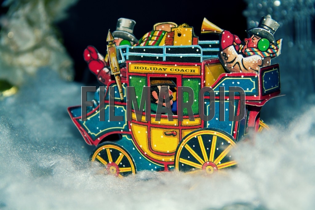 A Christmas Holiday Stage Coach with musicians traveling through a snowy landscape during one winter night