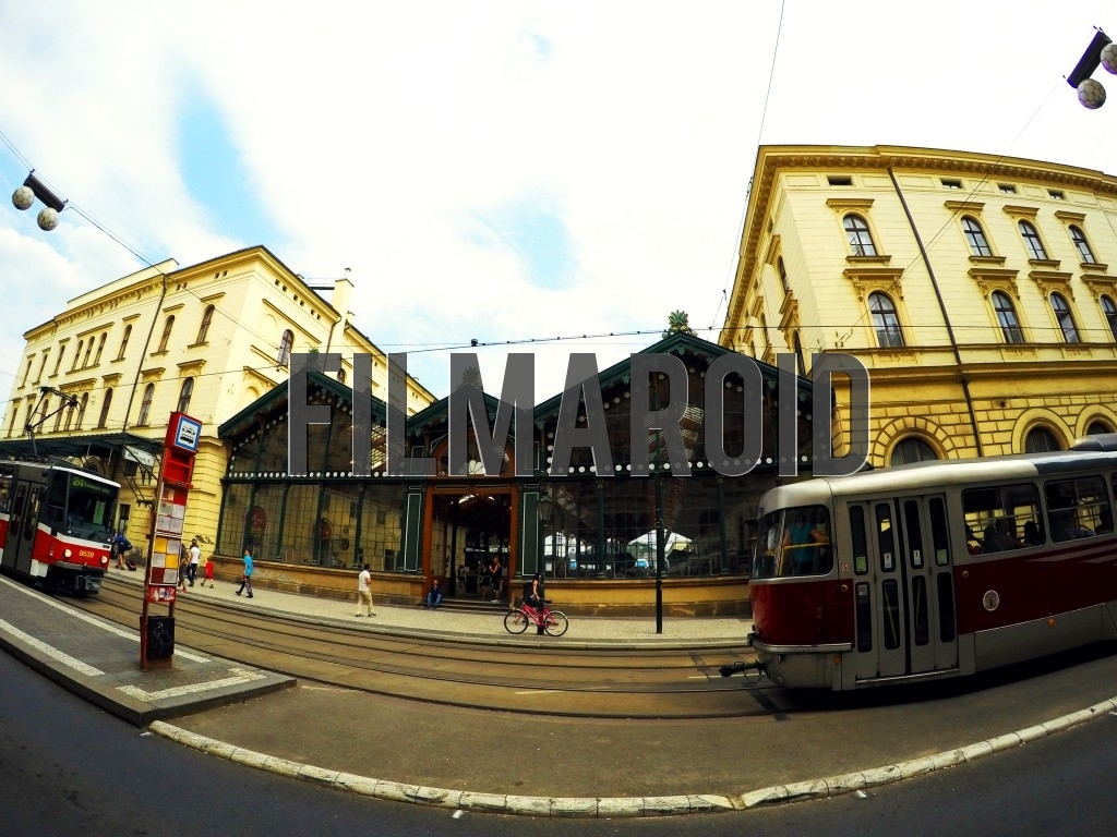Front view of a European Train Station Masarykovo Nadrazi in Prague with trams passing by